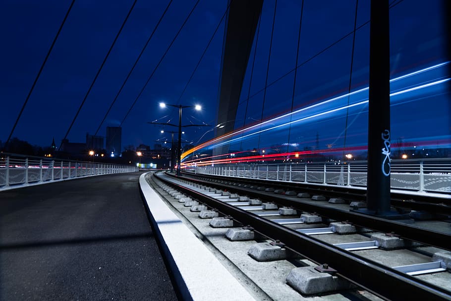 time lapse photo of train railway, timelapse photography during nighttime HD wallpaper