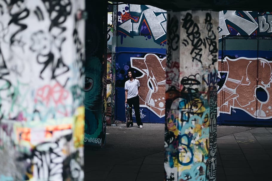 man standing next to wall graffiti, structure, building, art HD wallpaper