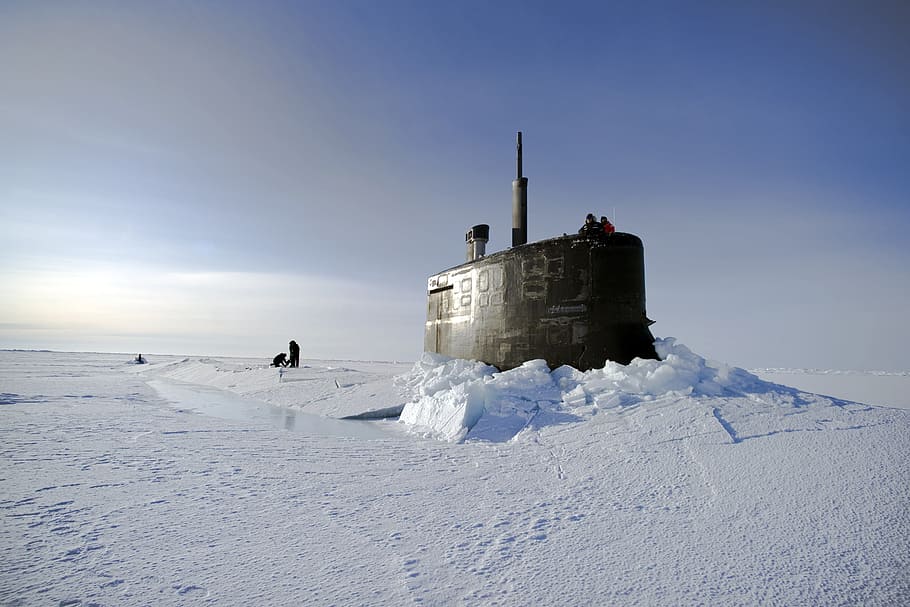 submarine stock in snow, arctic ocean, us navy, through the ice