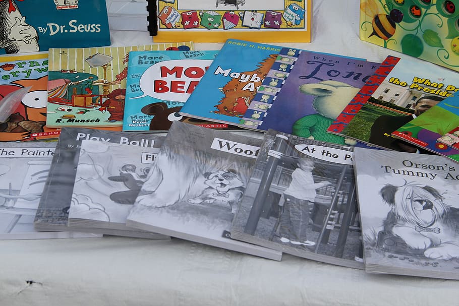 assorted storybook lot on table, books, reading, reading book HD wallpaper