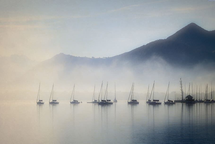 brown boats on lake with fogs near mountain, landscape, nature HD wallpaper