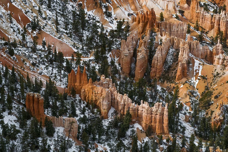 aerial photo of brown rock formations and trees, aerial view of green trees near rock cliffs HD wallpaper
