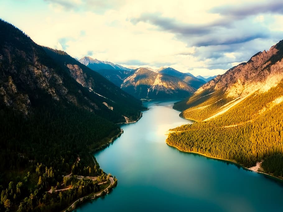 lake on foot of mountain under white clouds at daytimie, austria HD wallpaper