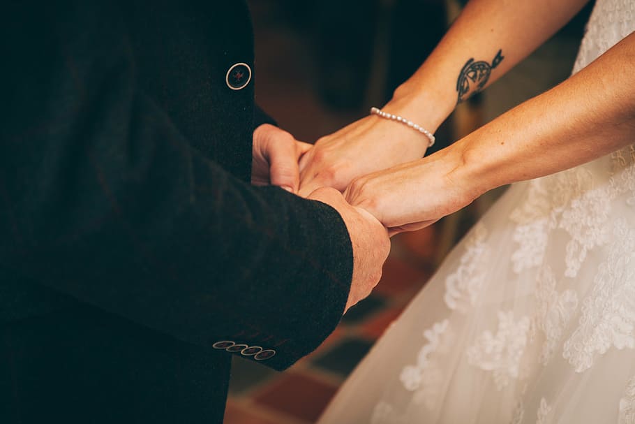 bride and groom holding hand together closeup photography, couple