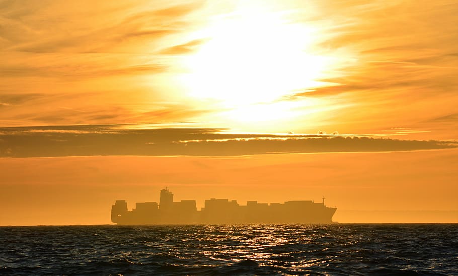 ENGLISH CHANNEL CONQUERED., silhouette of cargo ship on sea, sunset HD wallpaper