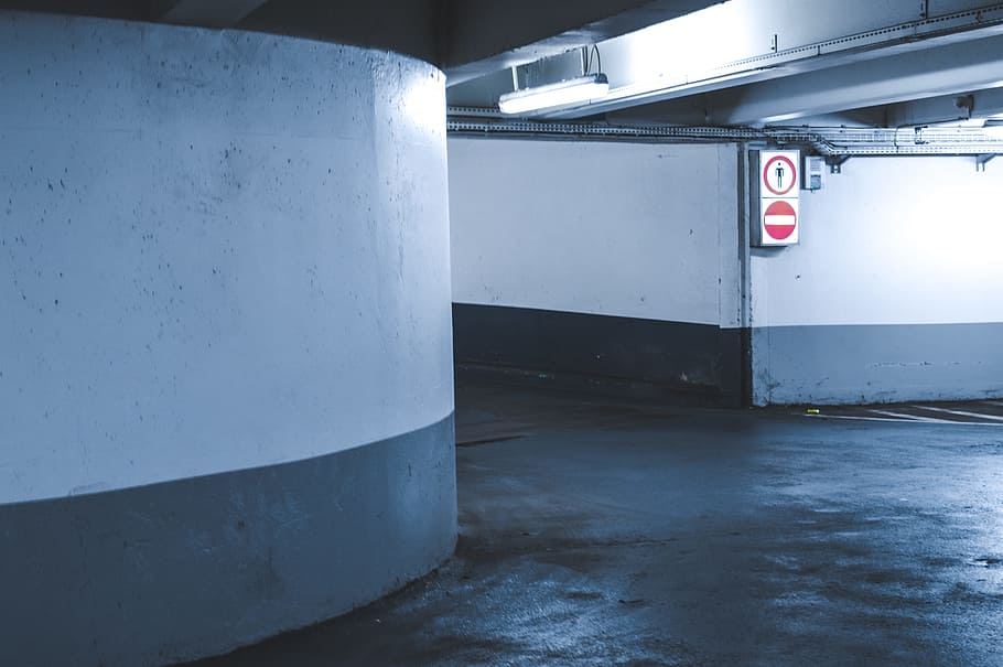 empty concrete hallway, two signage on white wall, gray, basement wall HD wallpaper