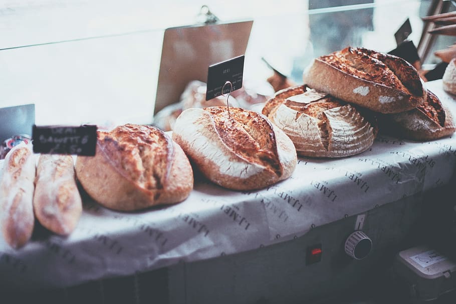bread in display counter, baked pastries on white surface, light, HD wallpaper