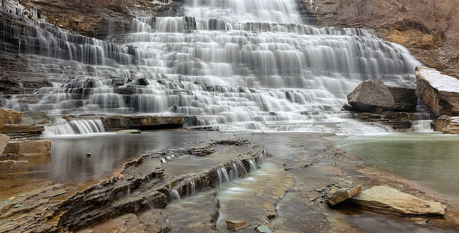 time-lapse photo of layered waterfalls, waterfall with surrounded by rock formation HD wallpaper