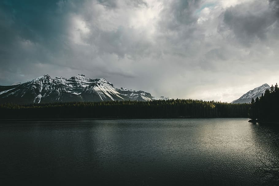 landscape photography of mountains near body of water, icy mountain and lake HD wallpaper