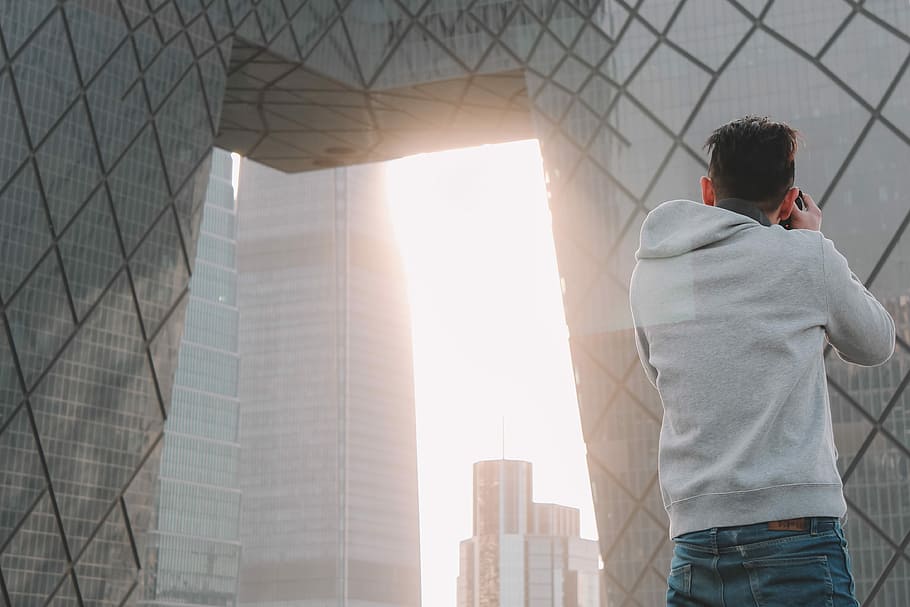 man taking a photo of buildings, man taking photo of building outdoor HD wallpaper