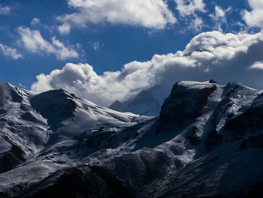 mountain covered with snow under cloudy sky, snow-covered mountains HD wallpaper