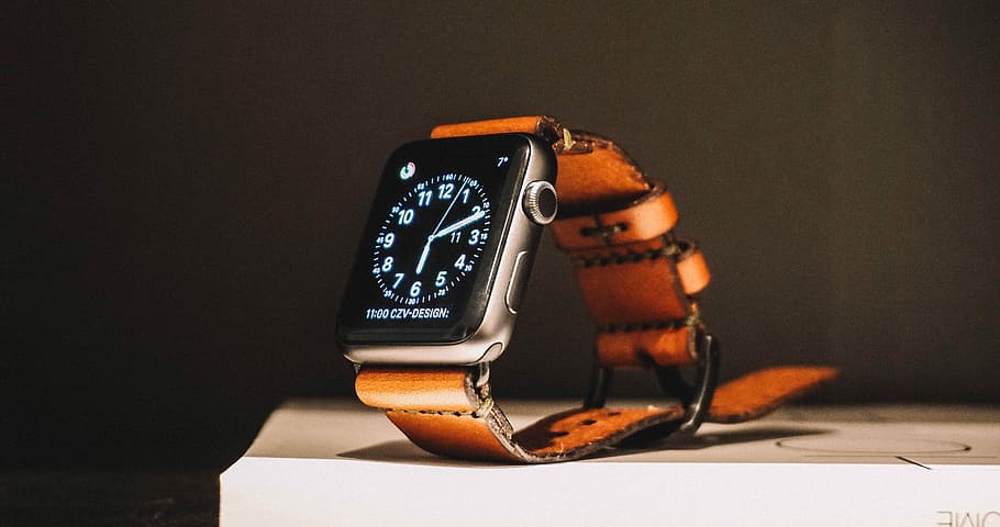 black smartwatch on box, silver case Apple Watch with brown straps on countertop, HD wallpaper