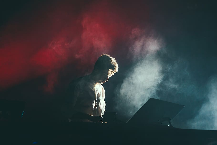 man operating DJ contrller, concert, stage, light, spotlight HD wallpaper