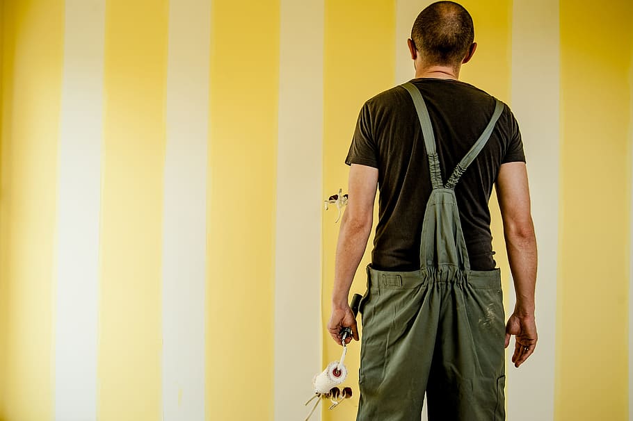 man in black shirt and gray pants with suspenders, building, painter