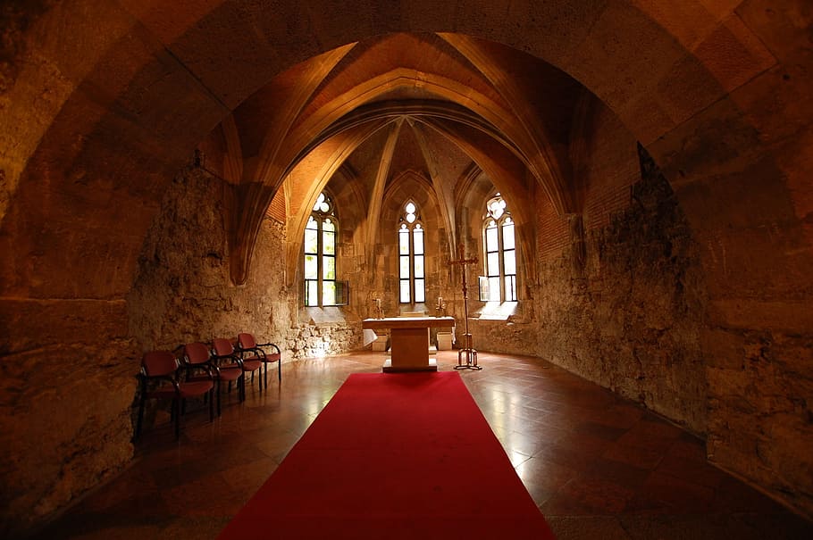 red runner rug in the beige wall room, interior church, buda castle