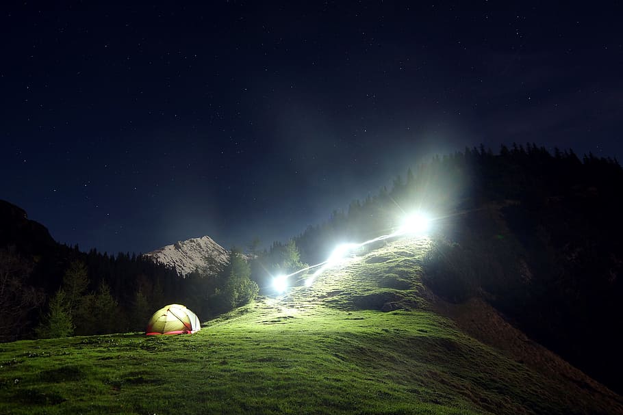 camping tent on mountain, yellow dome tent on green grass, green field