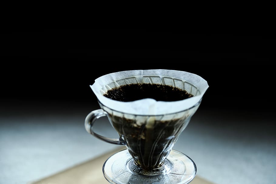 Filtered coffee V60, selective silhouette photography of filled teacup HD wallpaper