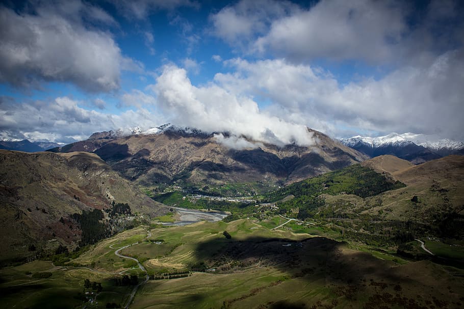 mountains under cloudy skies at daytime, mountain under cloudy sky HD wallpaper
