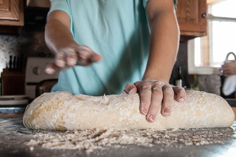 person kneading dough on the table, bread, baking, food, fresh
