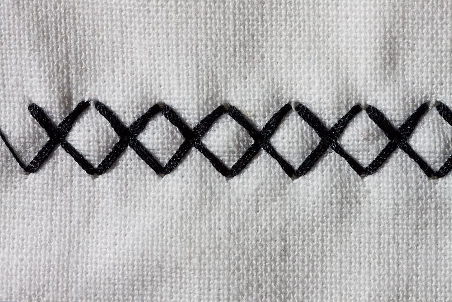 closeup photo of crisscross stitch, sewing machine, embroidery