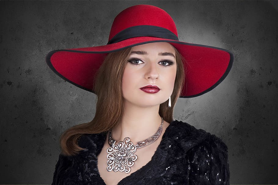 woman wearing black dress and red hat, the elegance, jewelry