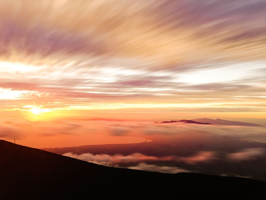 silhouette photo of mountain under orange sky, sunset view photo HD wallpaper