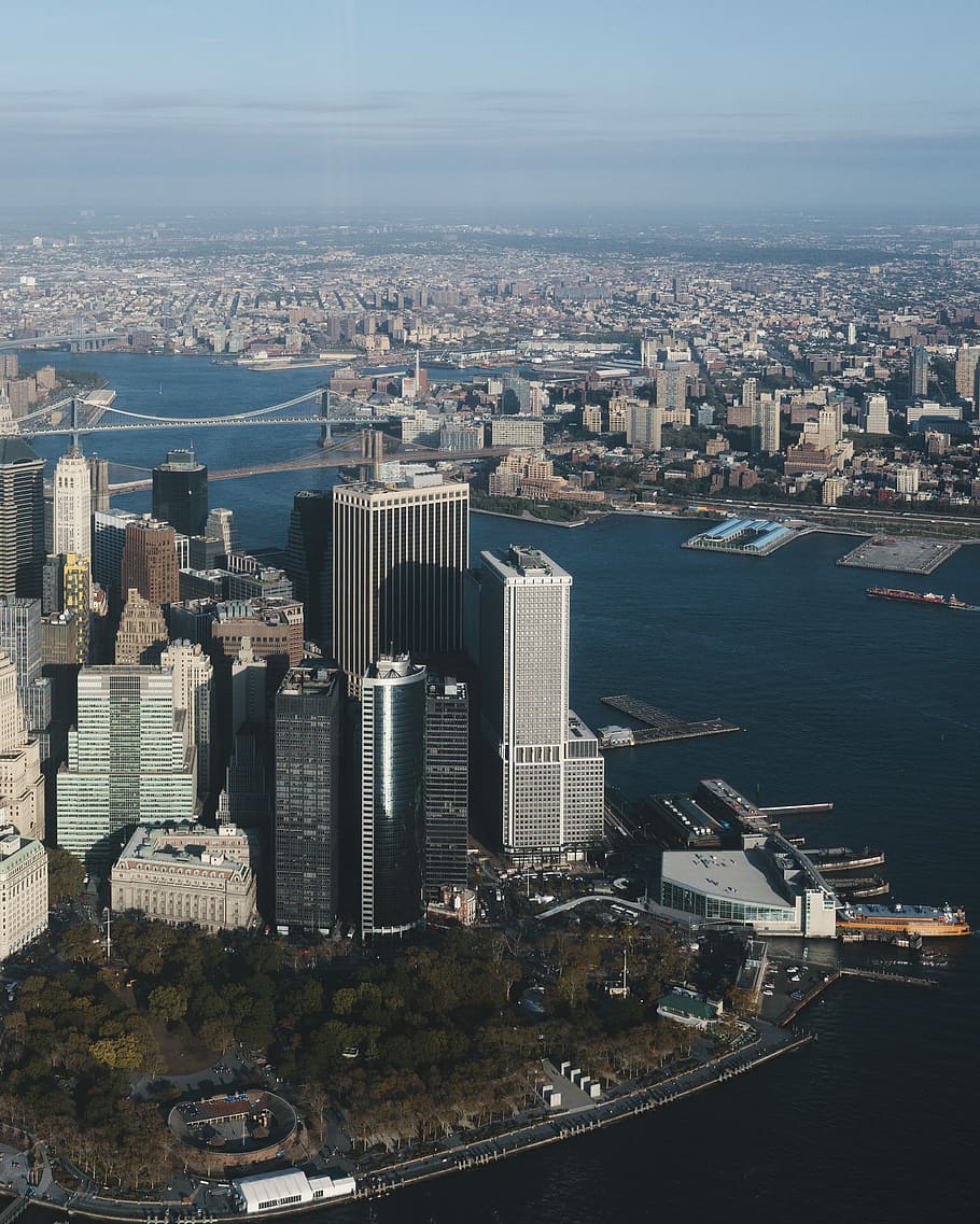 aerial view of skyscrapers, aerial photography of buildings near body of water HD wallpaper