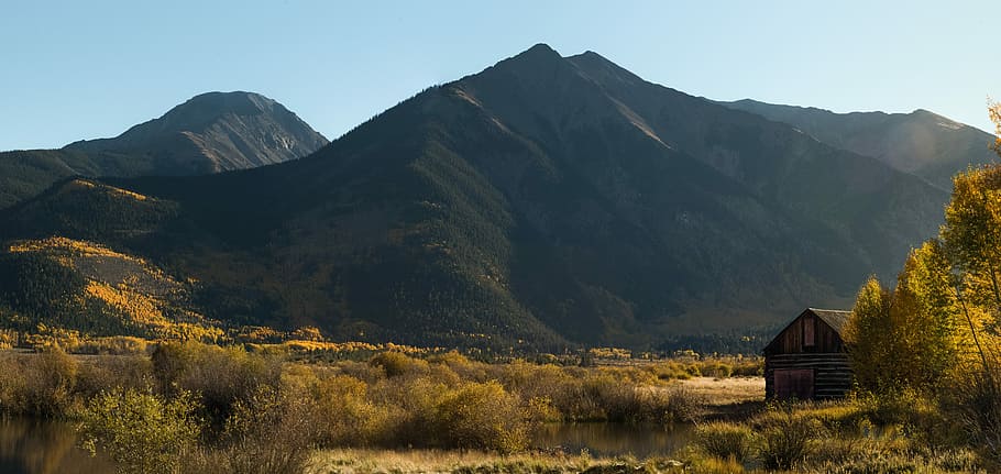 landscape photography of mountain, green grasses and mountain during day time HD wallpaper