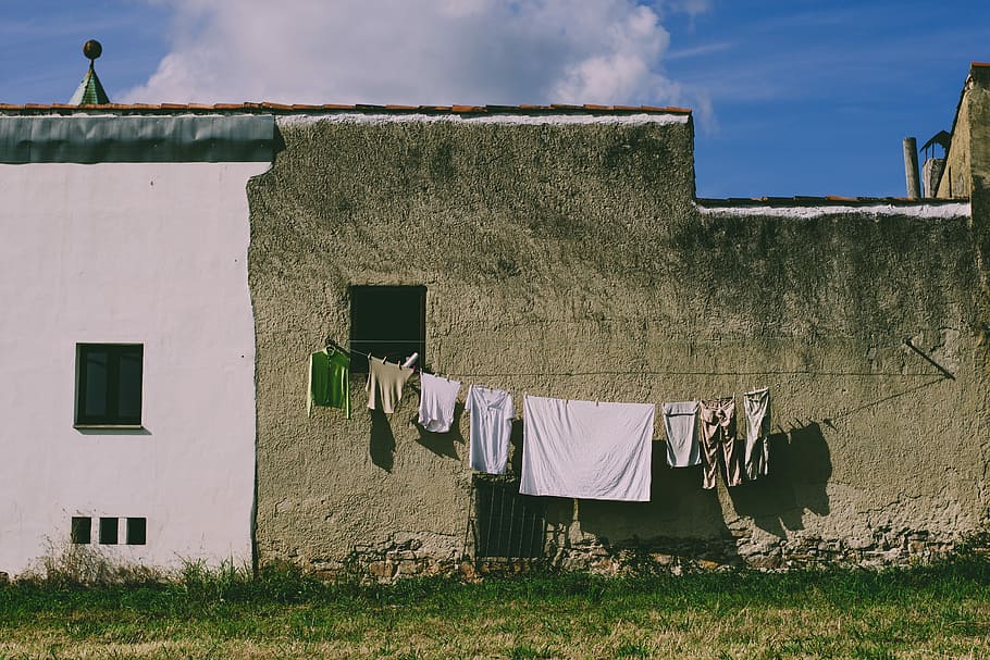Waiting for my ruca, white bed sheet on rope hanger, building HD wallpaper