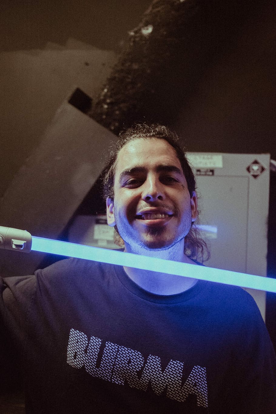 men's blue crew-neck shirt, man holding lightsabre, portrait HD wallpaper