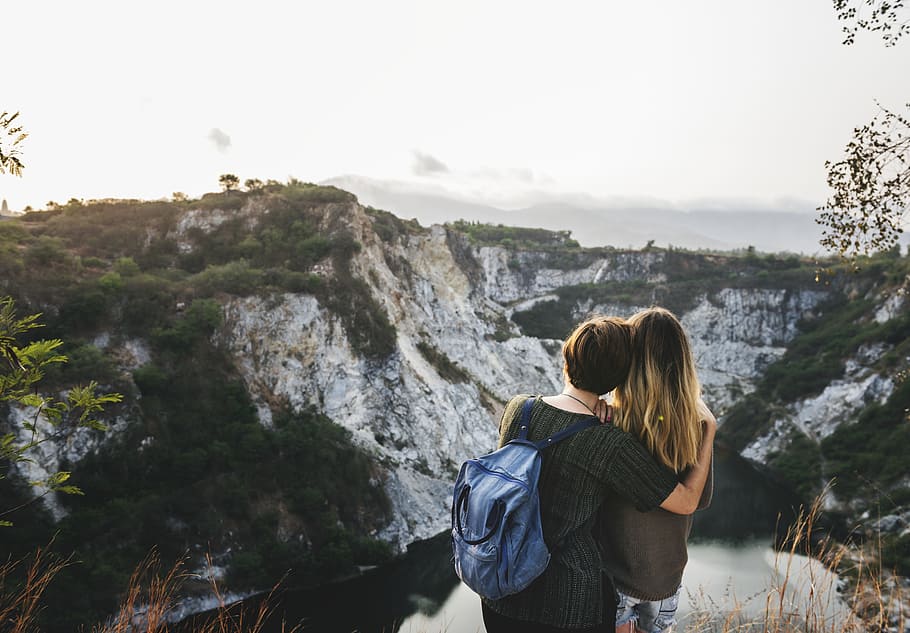 two person standing front of mountain, dom, travel, hiking, together