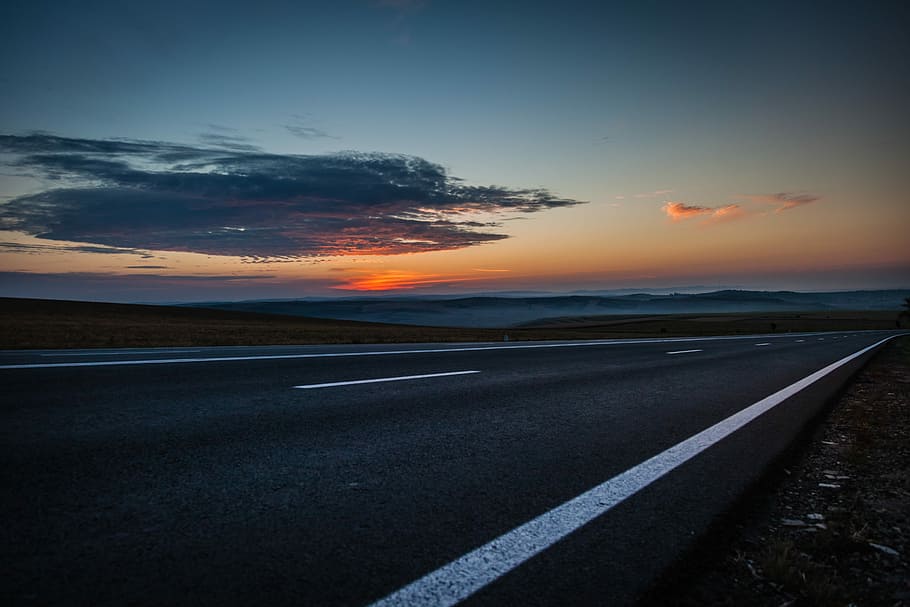 black concrete road during sunset, asphalt road during golden hour HD wallpaper