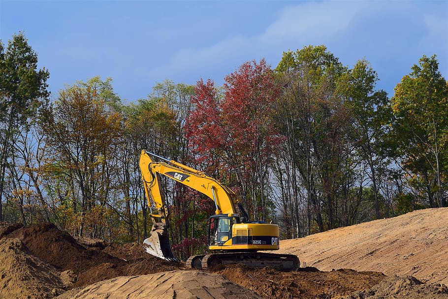 yellow front loader near green leaf trees at daytime, construction HD wallpaper