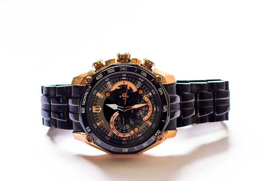 round black and gold-colored chronograph watch with link bracelet