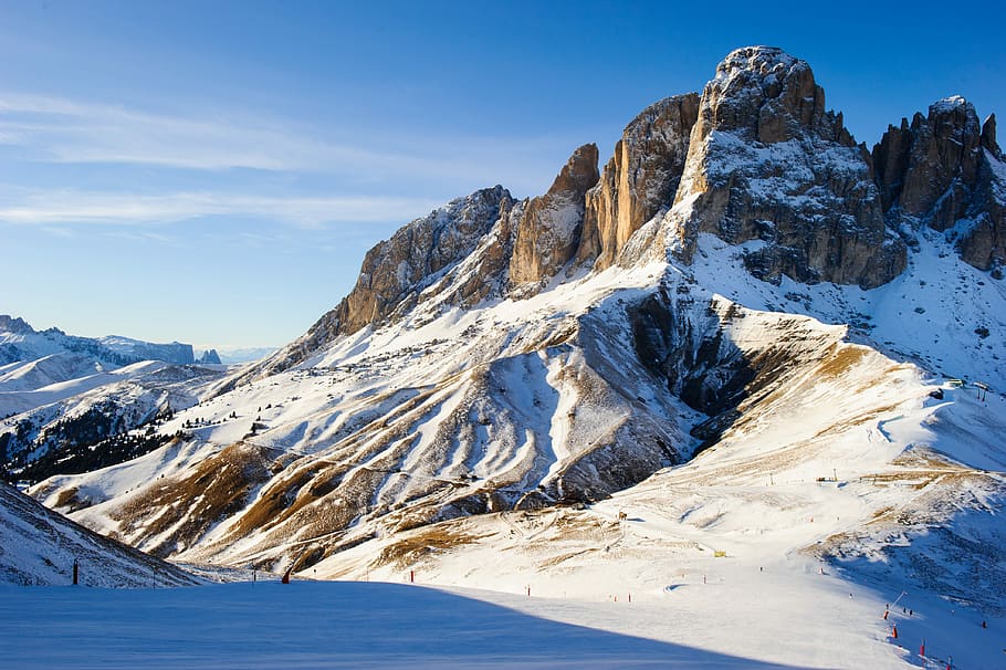 snow covered field and glacier mountains at the distance, rock formation with snow during daytime HD wallpaper