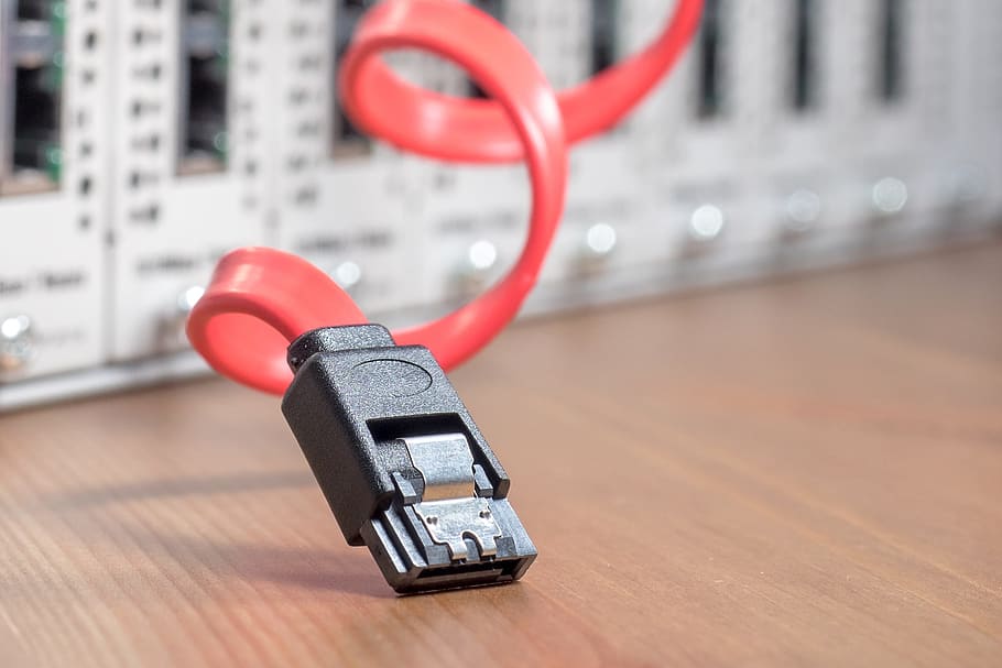 selective focus photography of USB cord on top of brown wood HD wallpaper