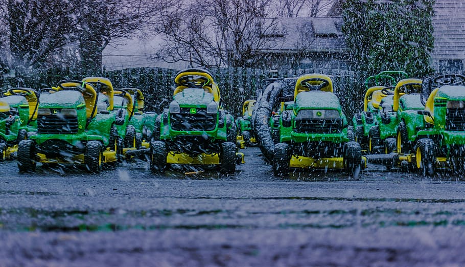 John Deere ride-on mowers parked on snow, lawn, tree, road HD wallpaper
