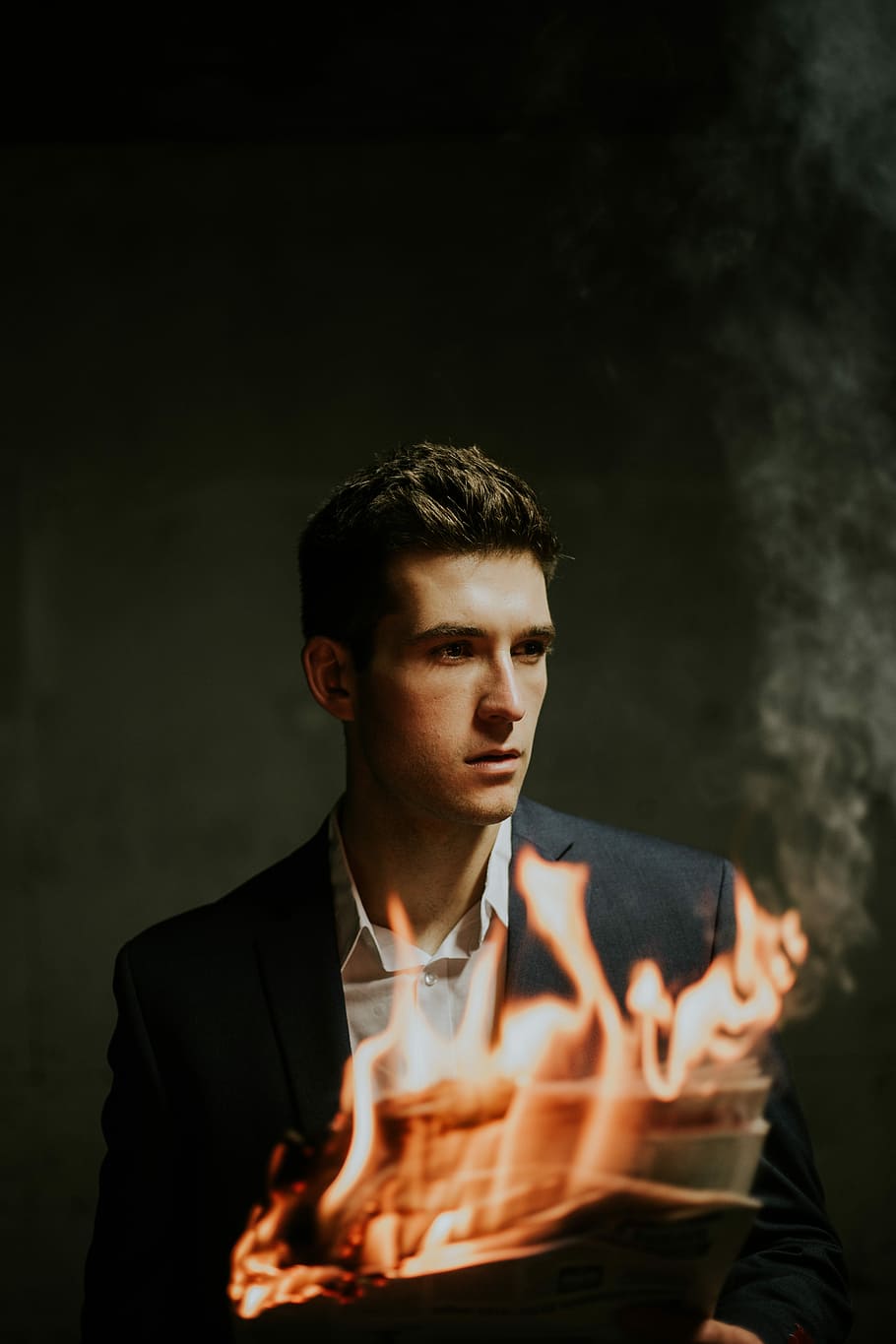 AJC flames, man wearing black blazer and white dress shirt holding newspaper with fire, HD wallpaper