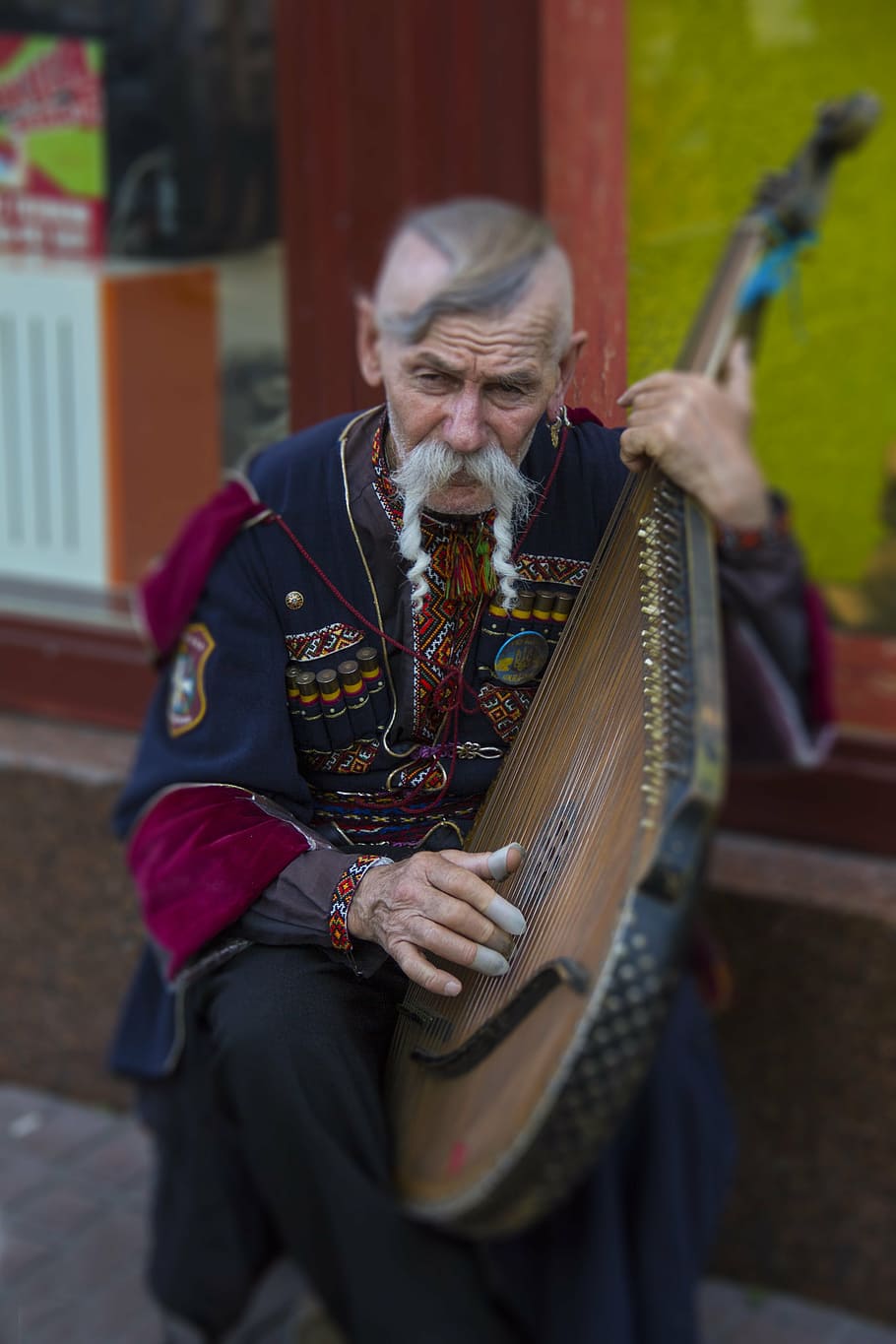 man playing brown wooden string instrument outdoors, ukraine, HD wallpaper
