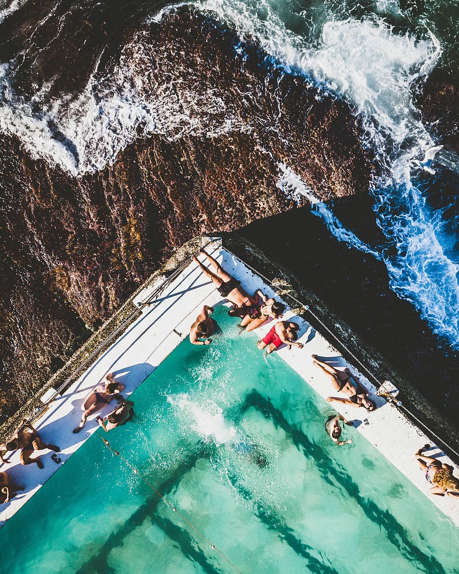 people beside pool, people sunbathing at the ship, wave, beach HD wallpaper