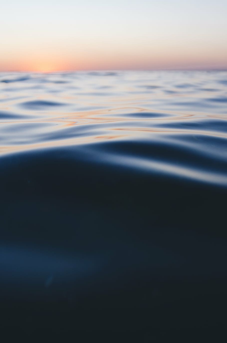 body of water under orange sky during golden hour, photo, blue HD wallpaper
