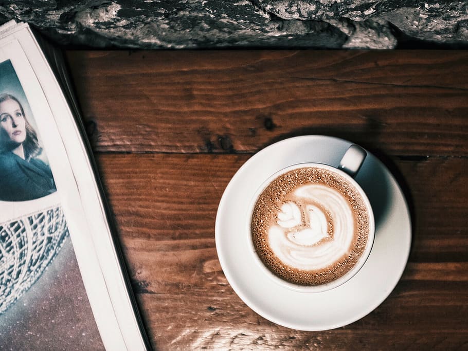 cappuccino on white ceramic cup and saucer, coffee, book, newspaper HD wallpaper