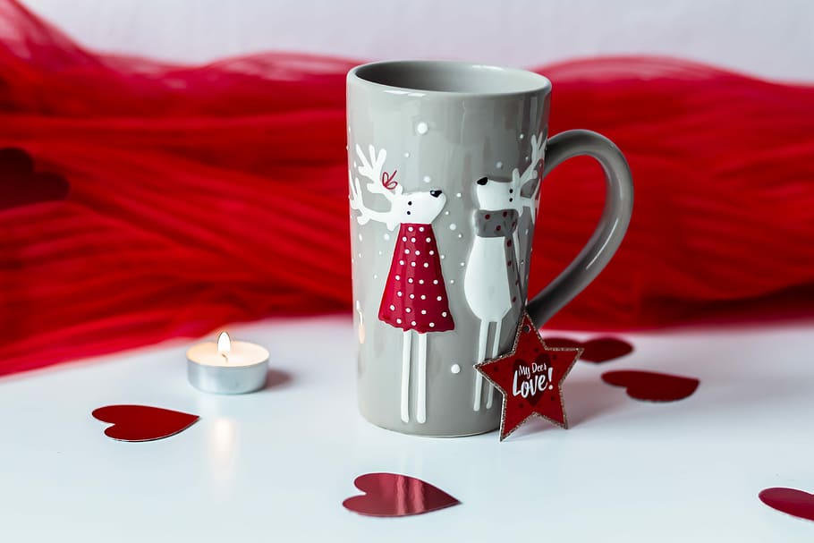Coffee with deers, gray ceramic mug beside white tealight candle HD wallpaper