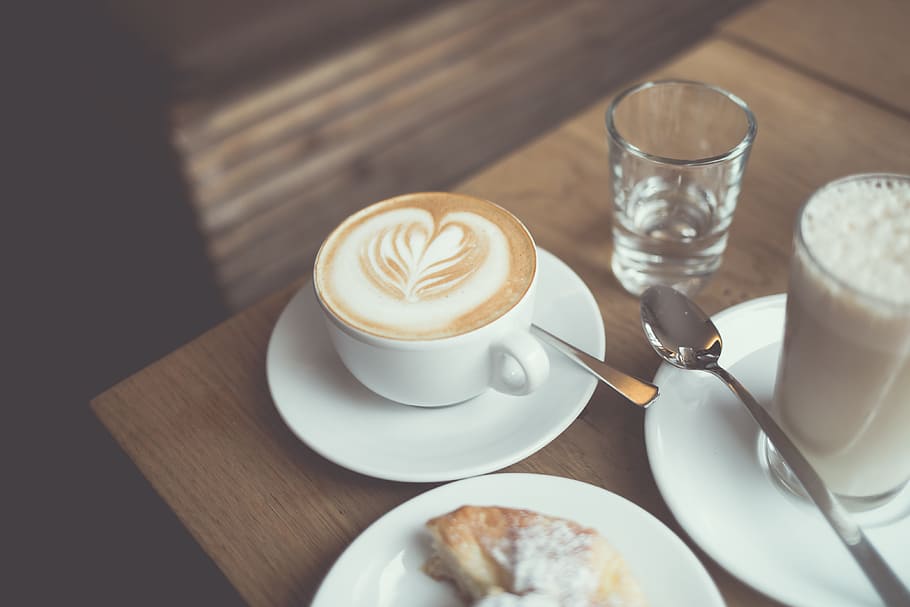 white cappuccino coffee near clear drinking glass, white ceramic teacup filled with coffee, HD wallpaper