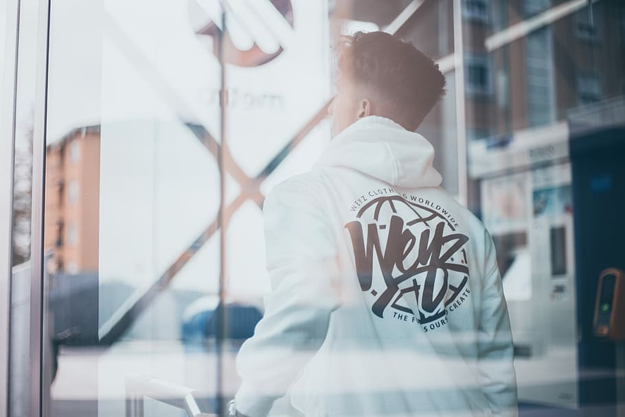 man near window, man in white and black hoodie standing near automated teller machine HD wallpaper