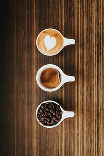 three white ceramic mugs, several white ceramic coffee mugs, beans HD wallpaper