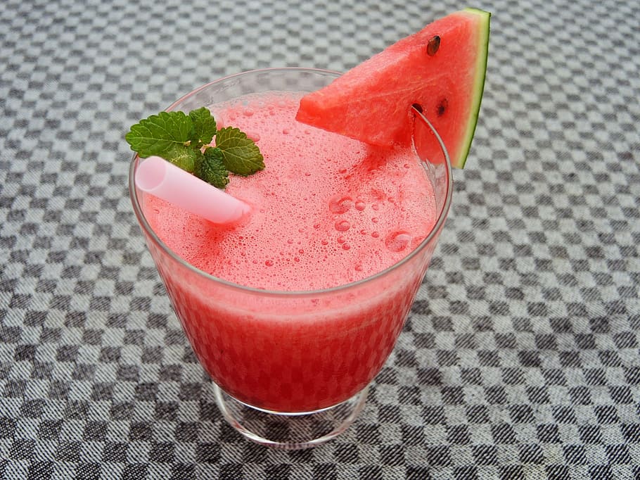 watermelon shake on clear drinking glass with slice of watermelon and white straw HD wallpaper
