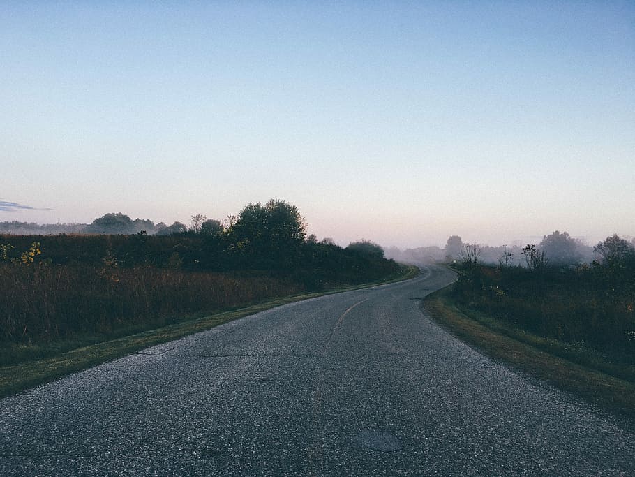 gray Asphalt road between green grass during dusk, nature, highway HD wallpaper