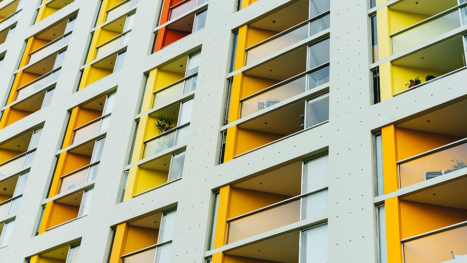 yellow and white city building, gray and yellow concrete building HD wallpaper