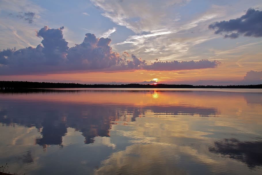 silhouette photo of body of water under white clouds and blue sky HD wallpaper